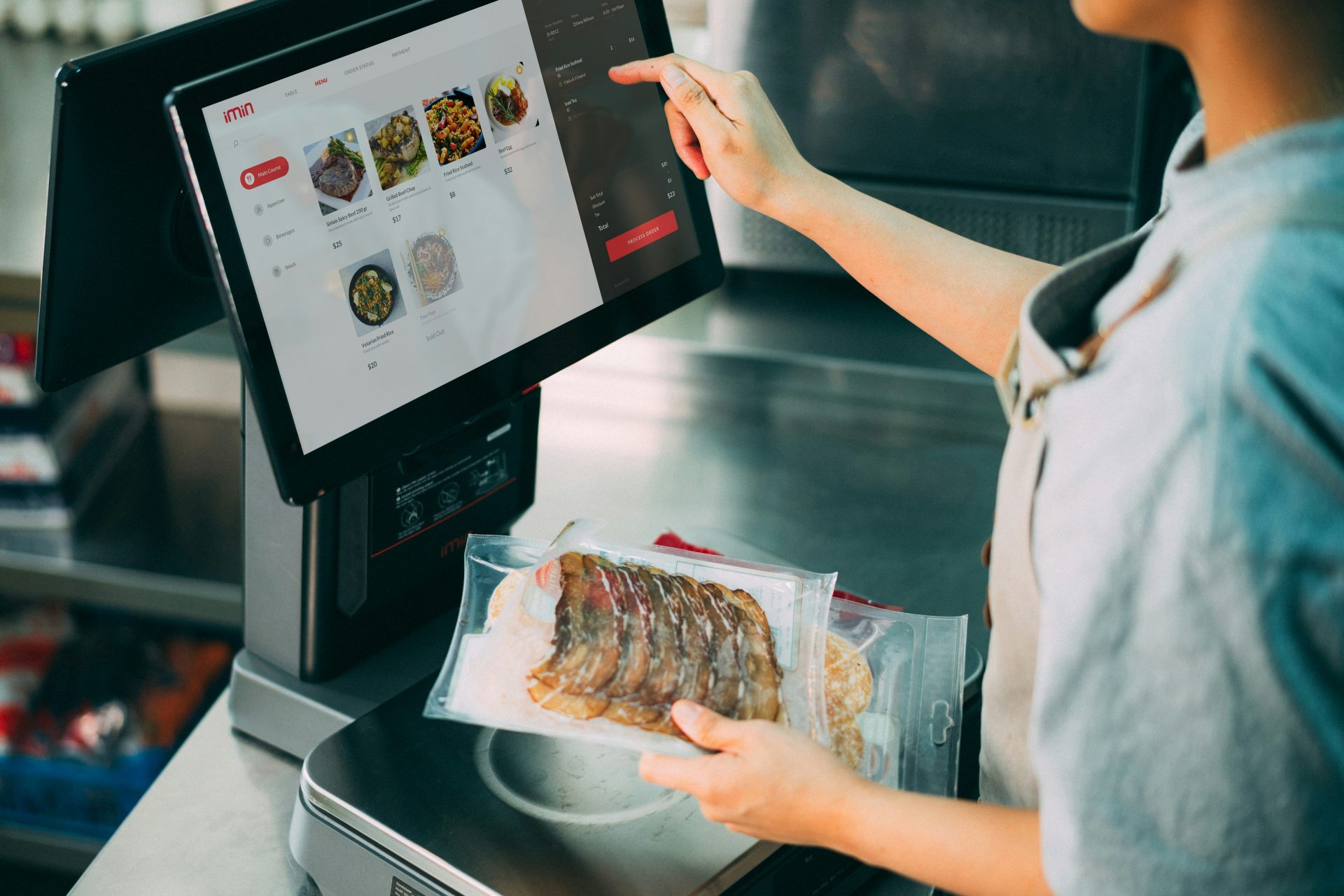 a person holding a tray of food